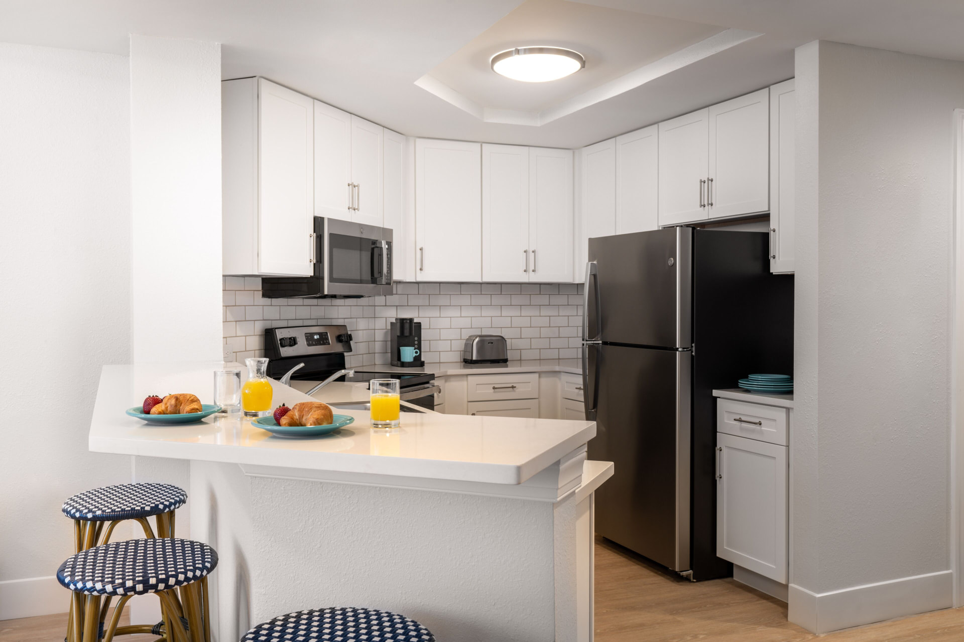 Full suite kitchen with breakfast bar and stainless appliances at Pink Shell Beach Resort