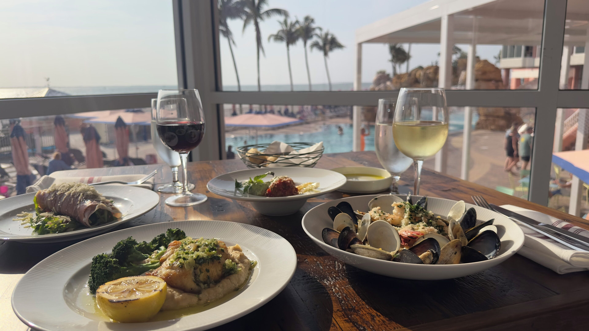 Seafood dinner with Gulf and pool views at a Pink Shell Beach Resort restaurant